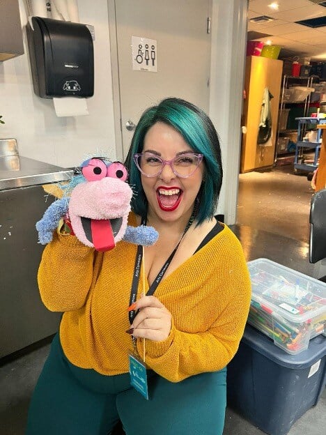 Dani Driusso with a puppet she created in the Arts Learning Centre at Arts Commons
